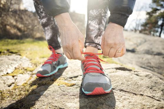Close up of person tying sneakers