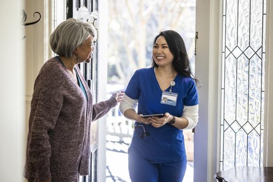 Home healthcare worker visiting patient at home