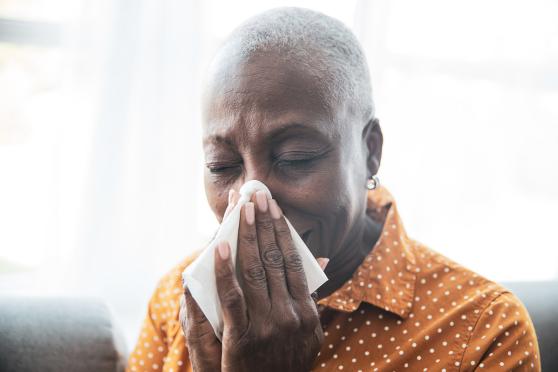 Woman using a tissue